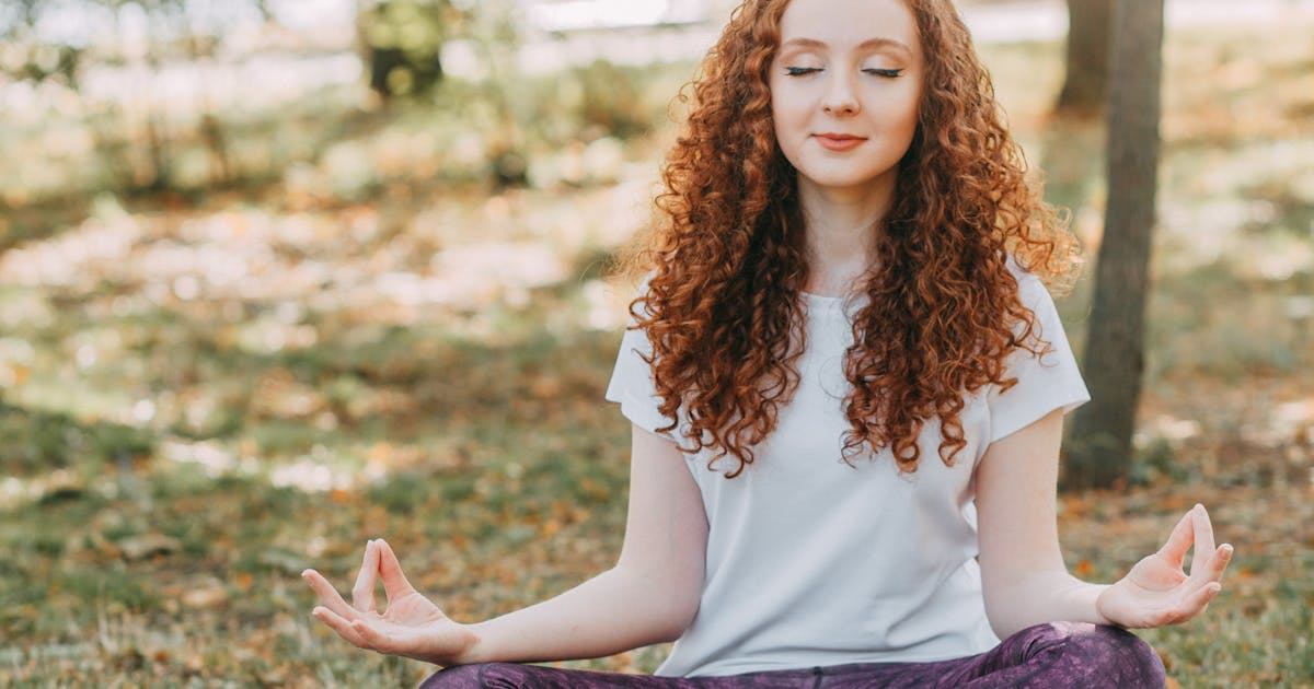 Meditating outdoors at sunrise for natural stress relief